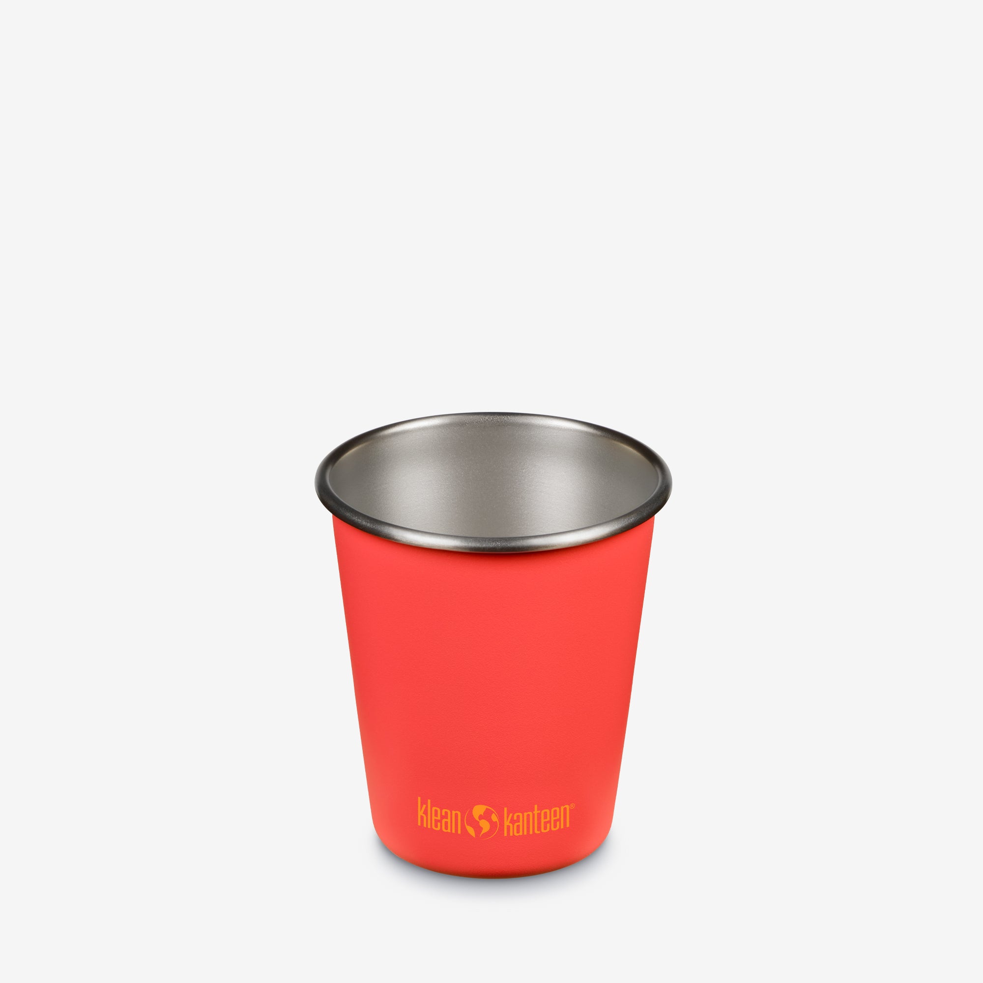 Red cup with a silver rim on a white background