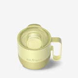 Yellow coffee mug top angle view with slide lid