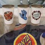 Three white cups with Santa Cruz logos and graphics on a reflective surface.