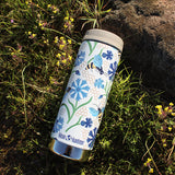 Klean Kanteen tumbler with flowers and bees design in the grass
