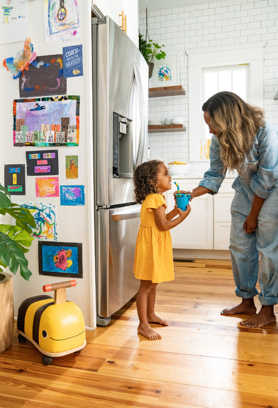 Kid's Cup with girl in kitchen