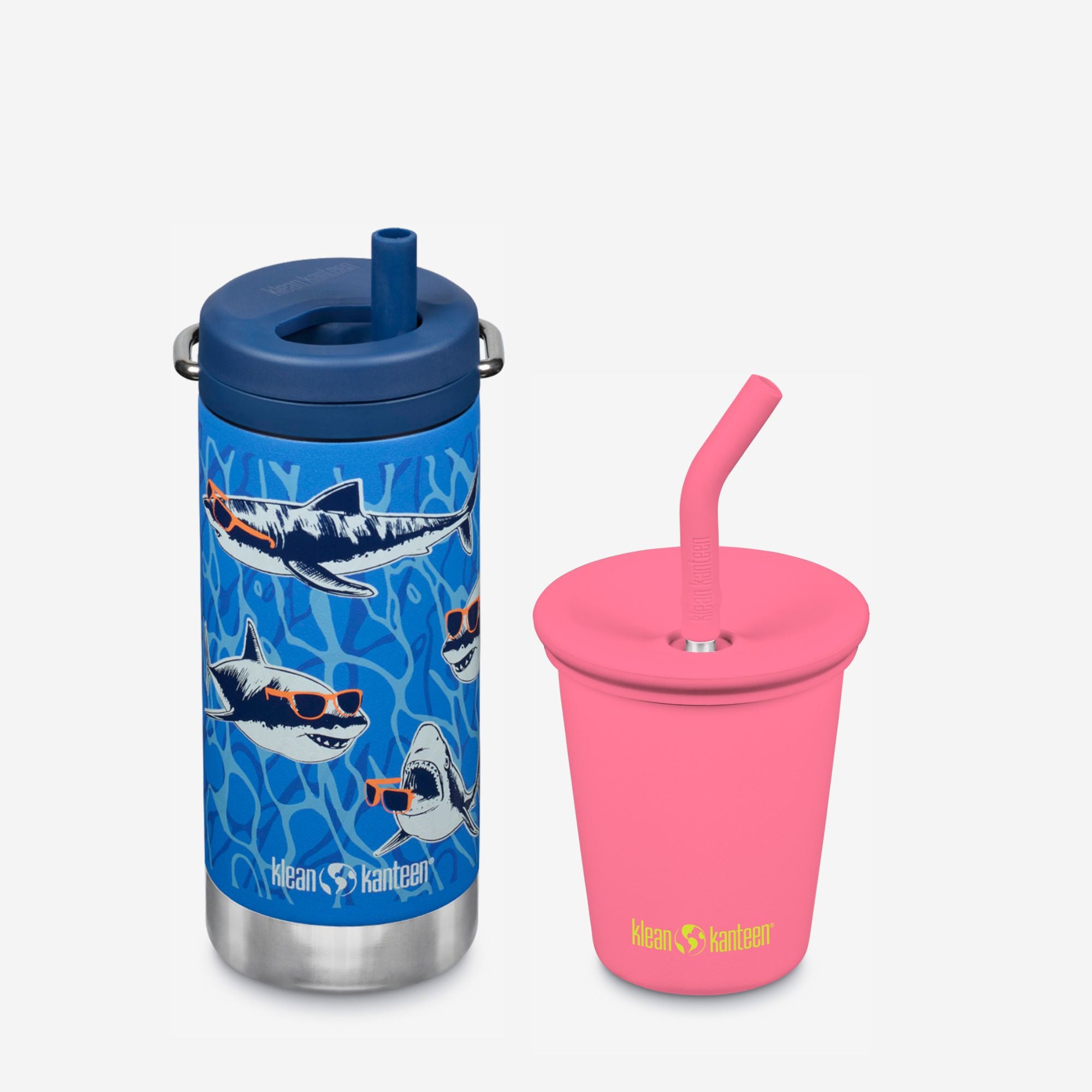Blue water bottle with shark design and pink cup with straw on a white background