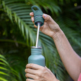 Flip Seal Sport Cap - with steel straw pulling out of bottle