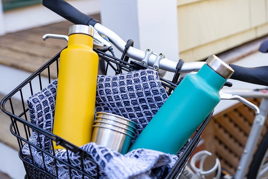 Pour Through Steel Bottles with Cups in Basket