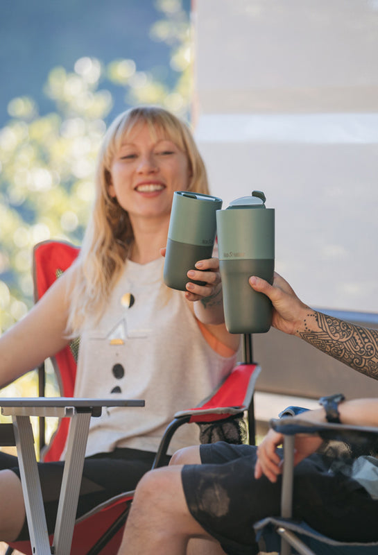 Woman with Tumbler in camp chairs