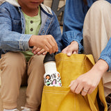 Kid pulling sports bottle out of purse