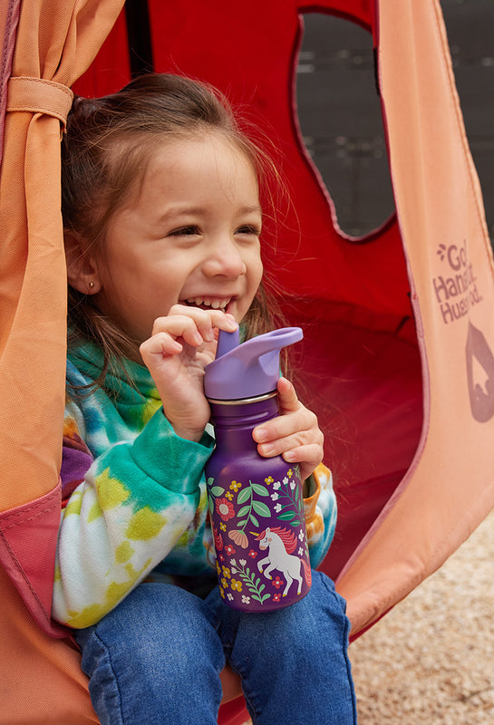 Girl in swing with water bottle
