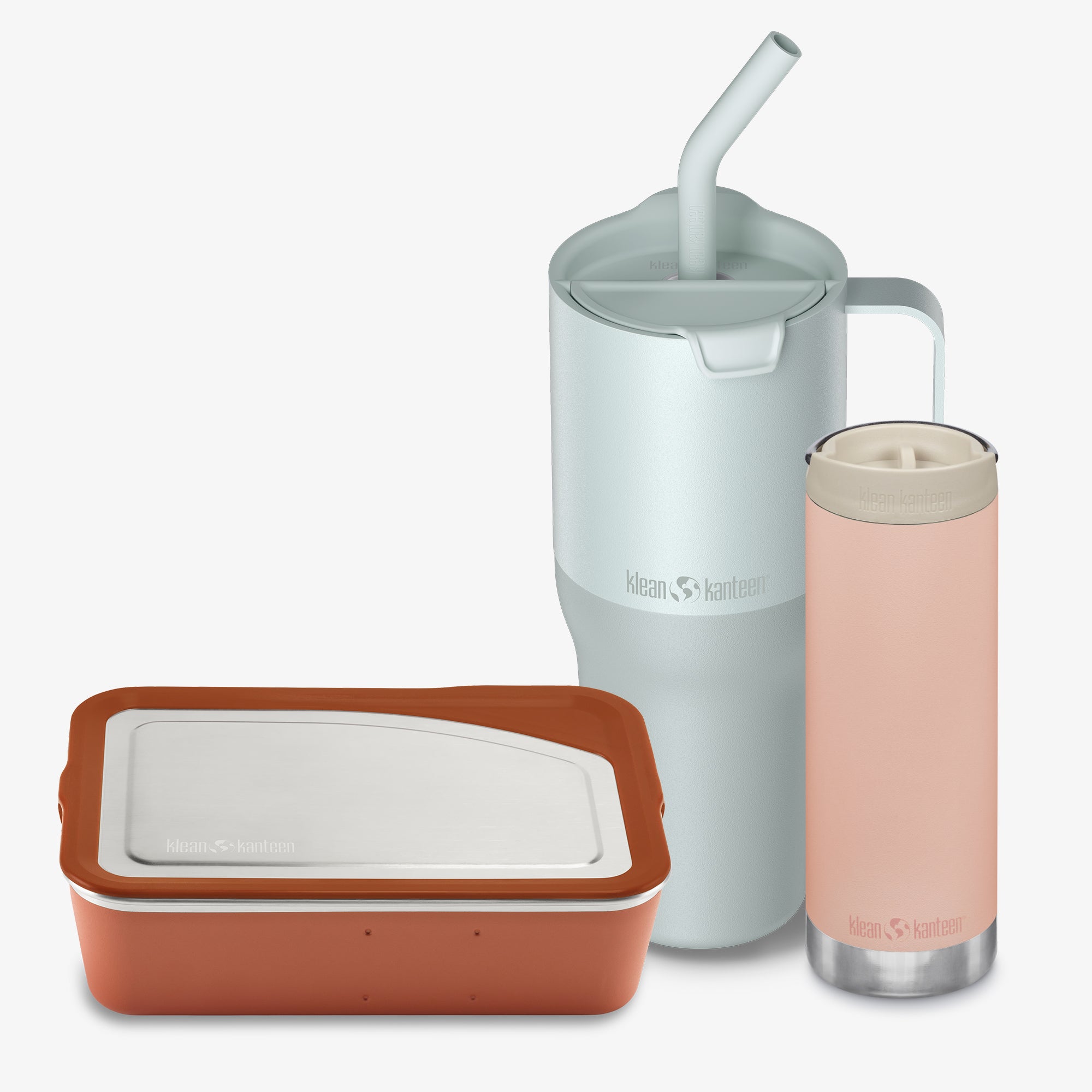 Set of reusable containers with a silver pitcher and pink tumbler on a white background