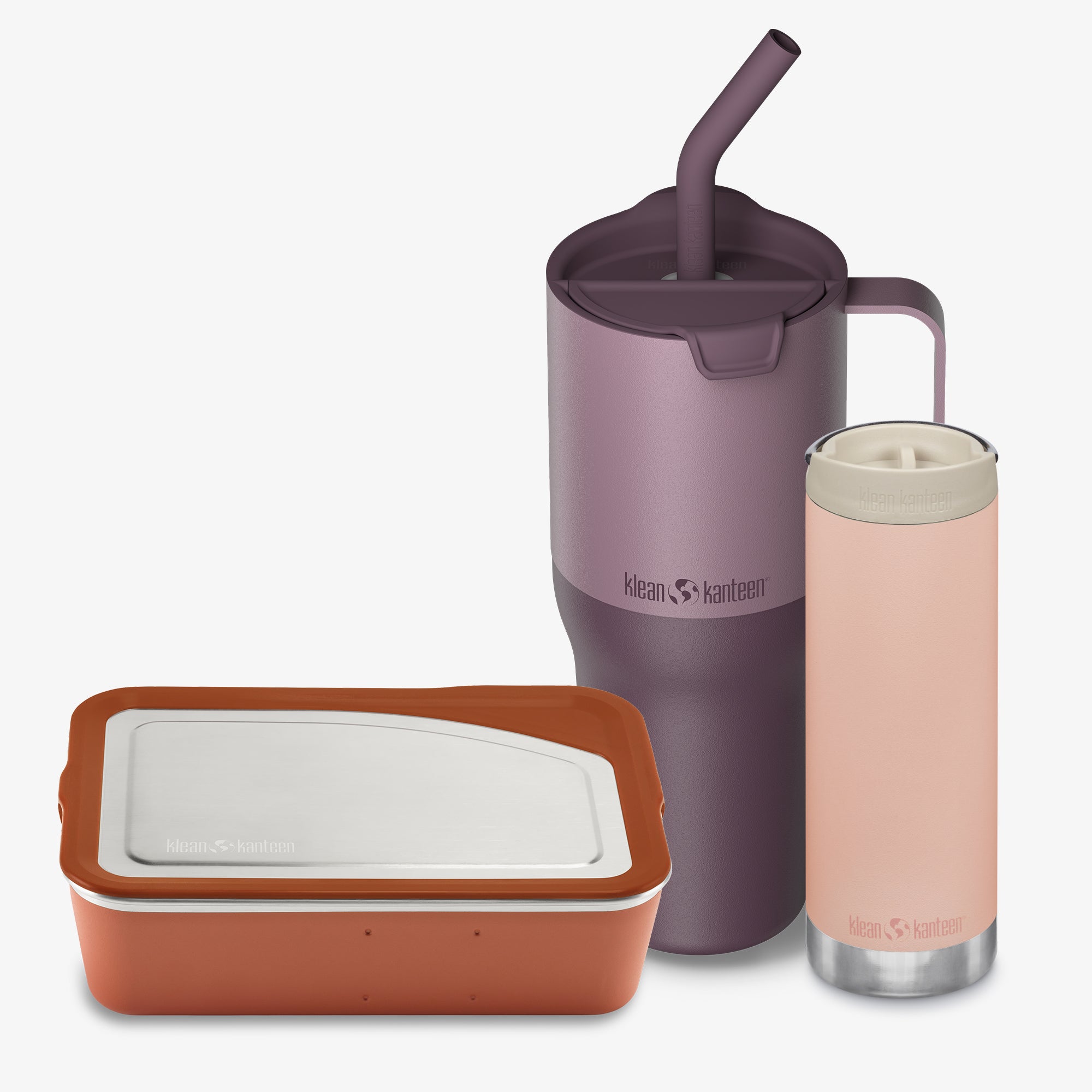Set of insulated containers with a purple tumbler and pink bottle on a white background