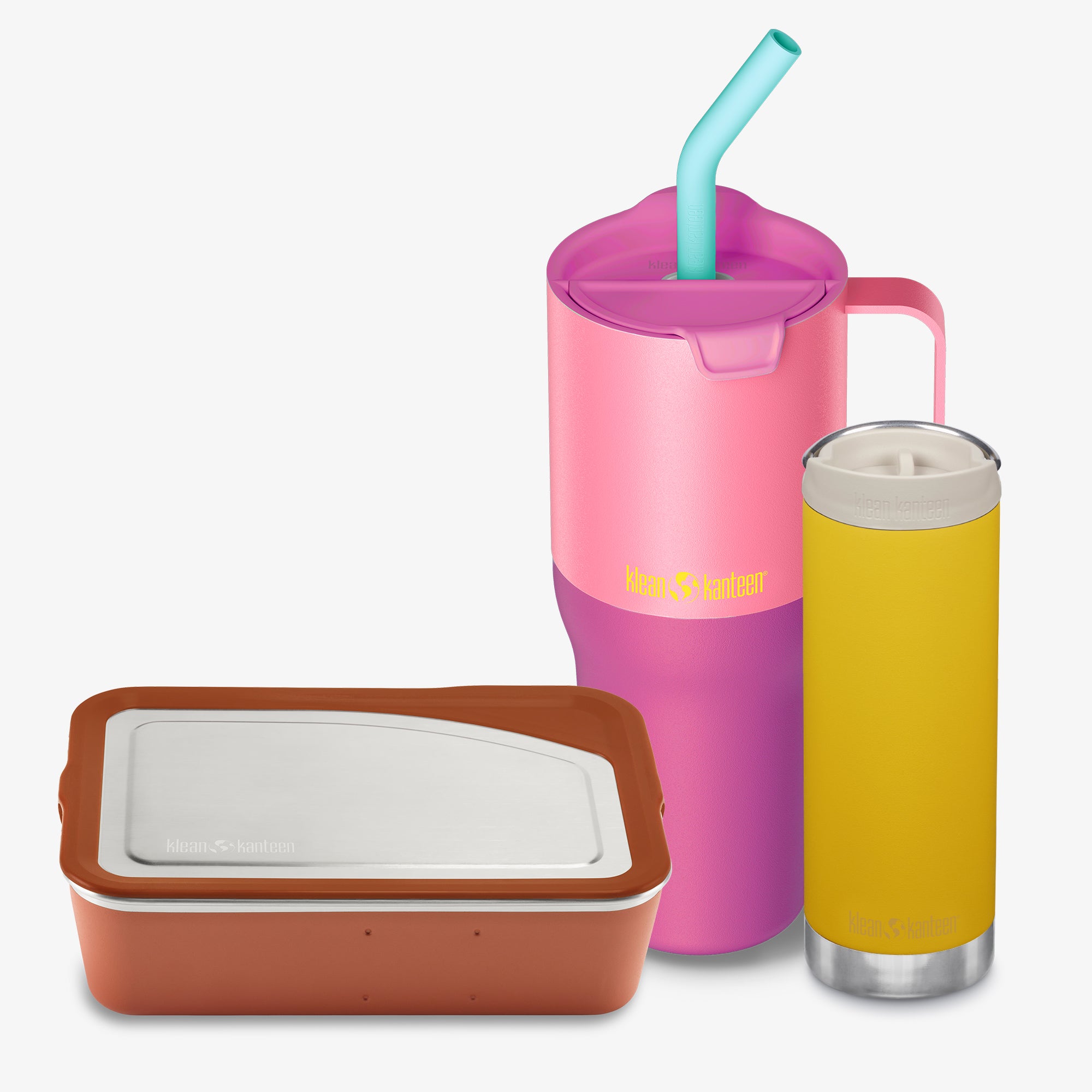Pink tumbler with straw, brown container, and yellow glass on a white background