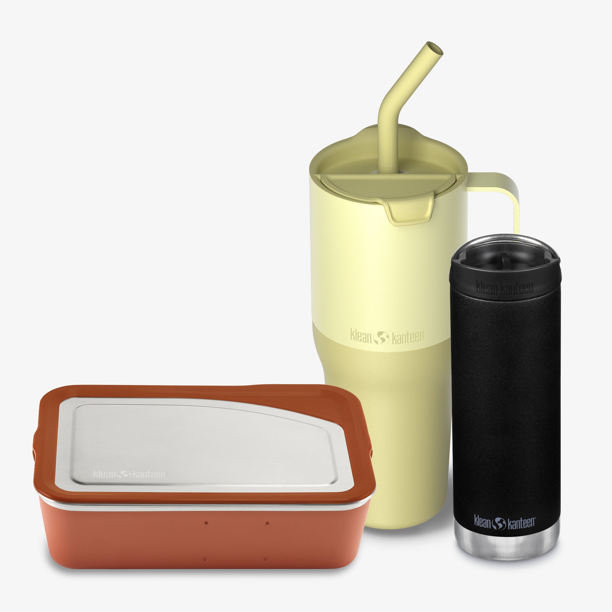 Three insulated containers with lids and a straw on a white background