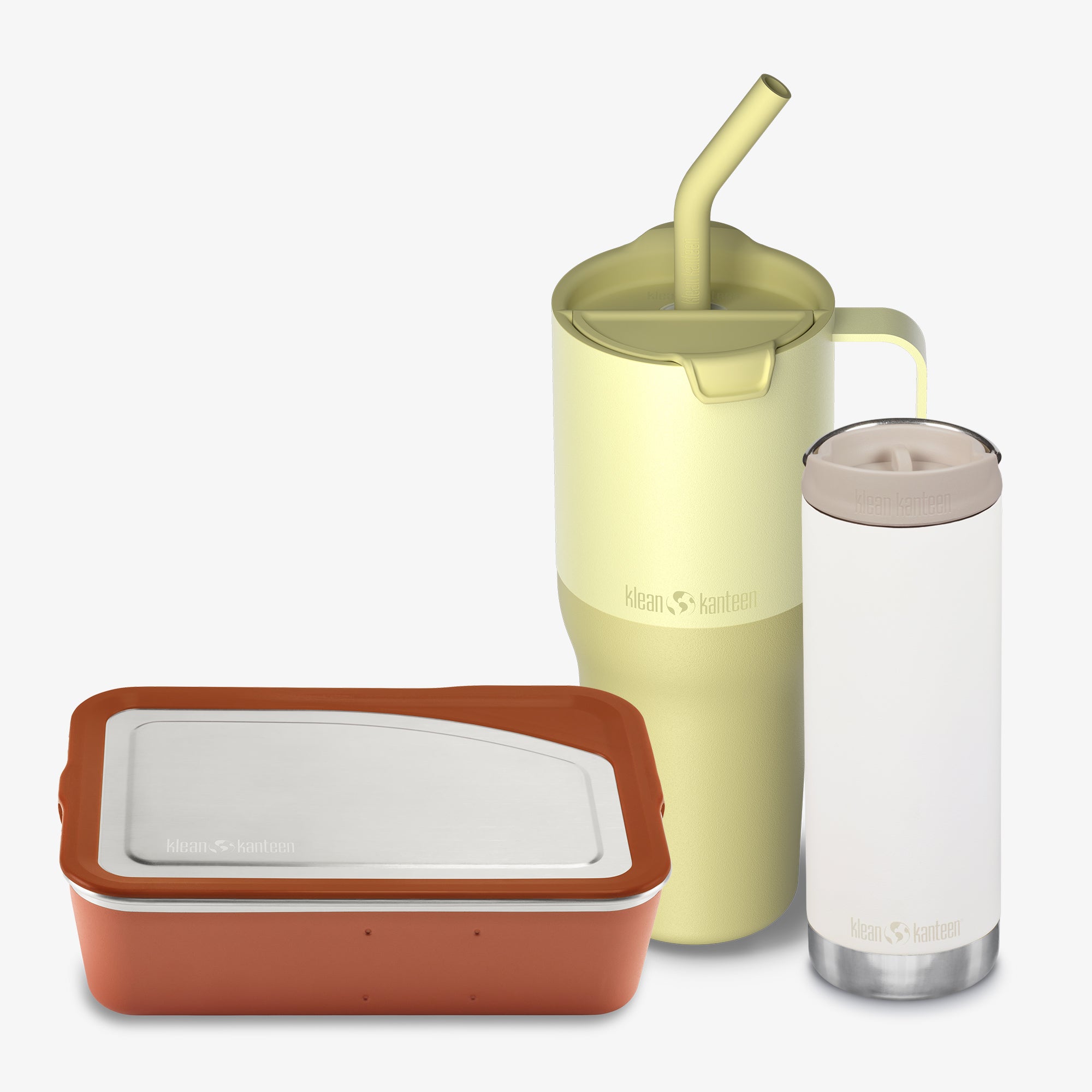 Set of reusable containers with a green tumbler and clear bottle on a white background
