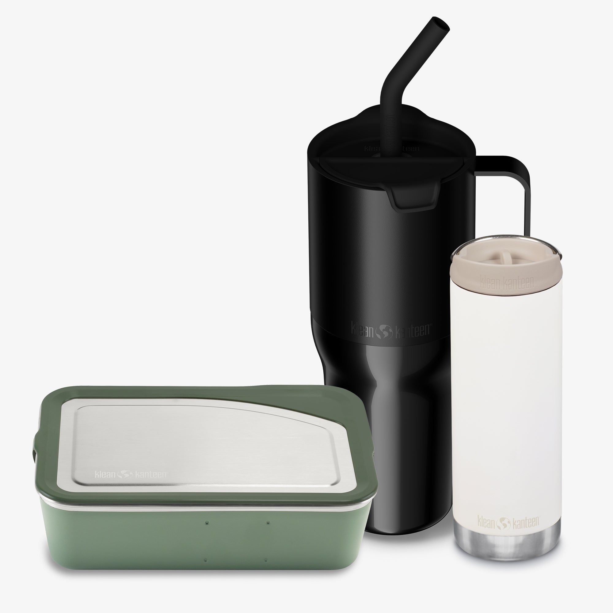 Set of reusable containers including a black tumbler with straw, a clear tumbler with beige lid, and a green food container on a white background.