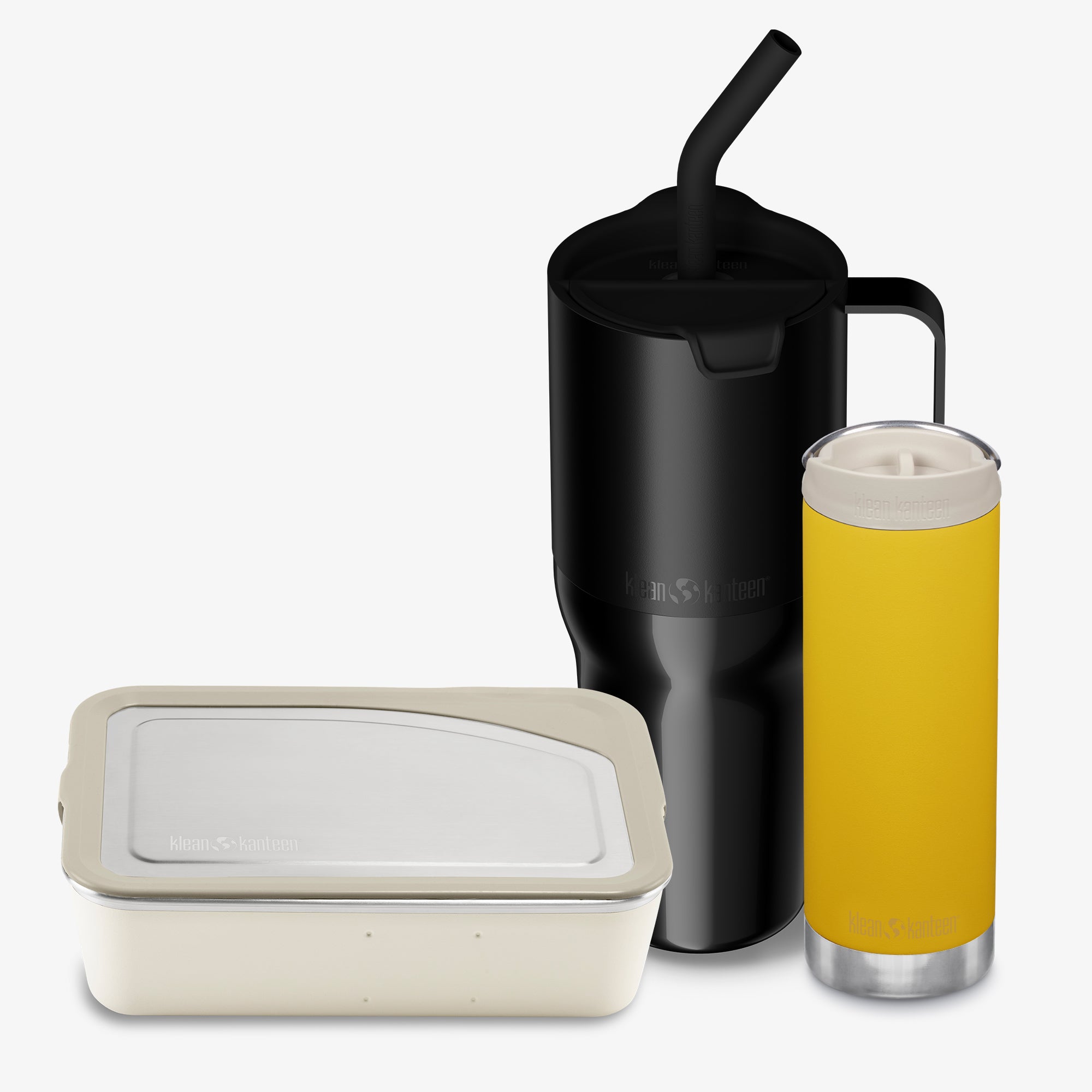 Black insulated mug with straw, beige container, and yellow tumbler on a white background