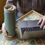 Green insulated tumbler with laptop