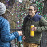 Man and women with coffee tumblers