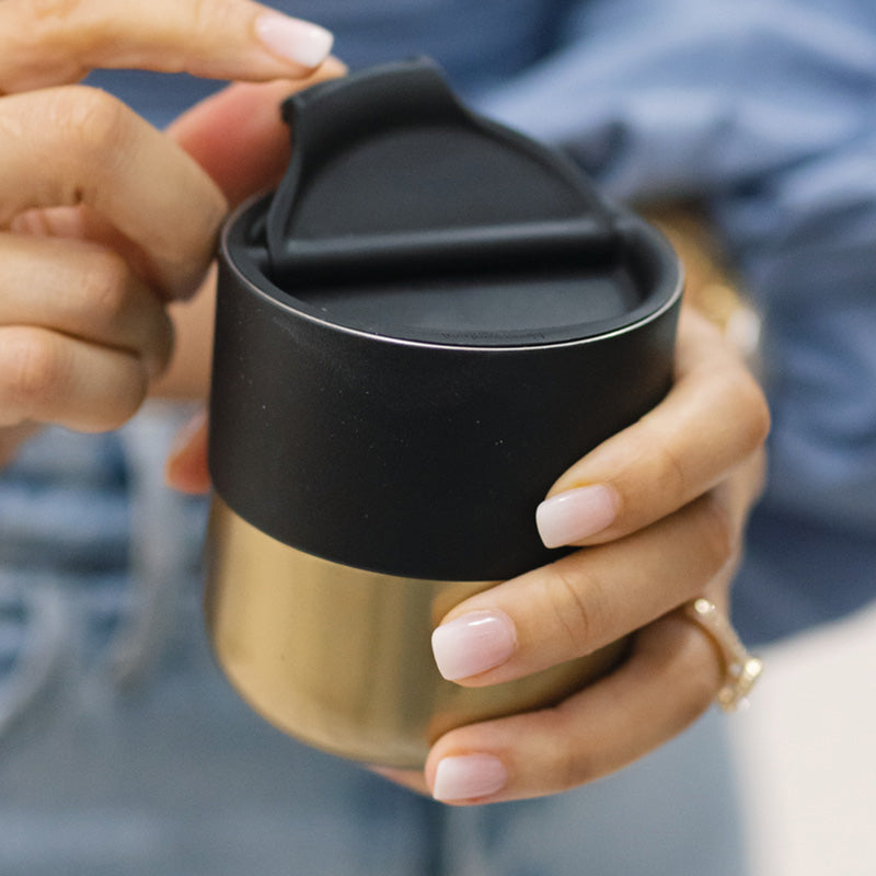 Black and gold lowball tumbler with flip lid