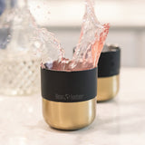 Lowball cocktail tumbler with splashing drink