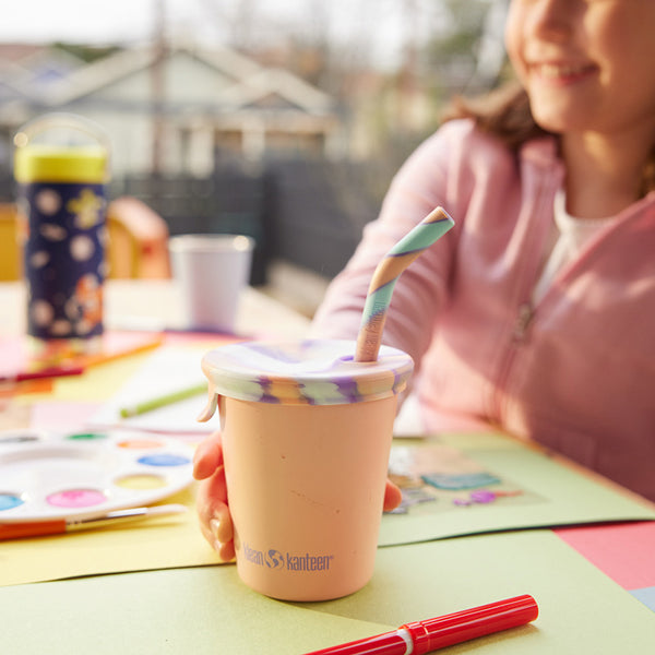 Close up of kid's sippy cup with straw