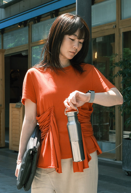 Office woman with Reflect water bottle in city