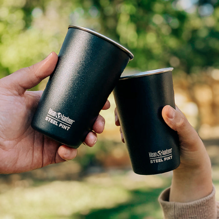Cheers with black steel pints