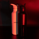 Black and white water bottles with red glow