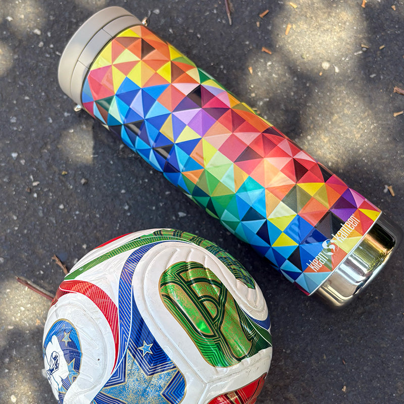 Colorful geometric-patterned water bottle and a soccer ball with a similar design