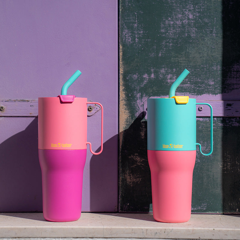 Two colorful tumblers with straws 