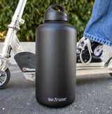 Black water bottle with scooter in background