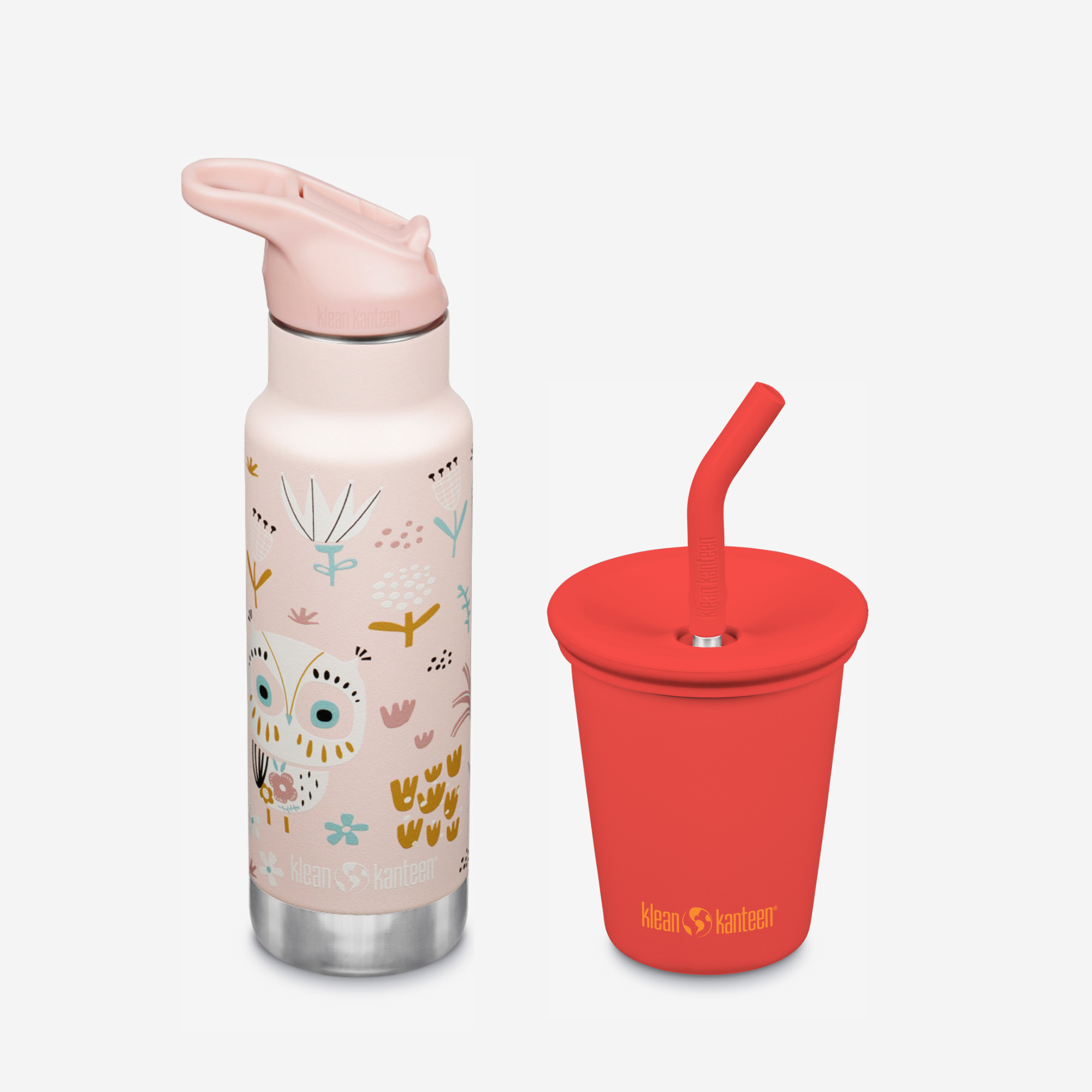 Pink water bottle with animal illustrations and red cup with straw on a white background