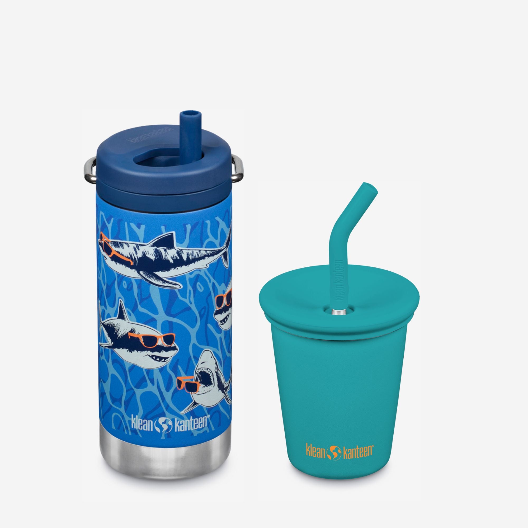 Blue tumbler with shark design and teal cup with straw on a white background