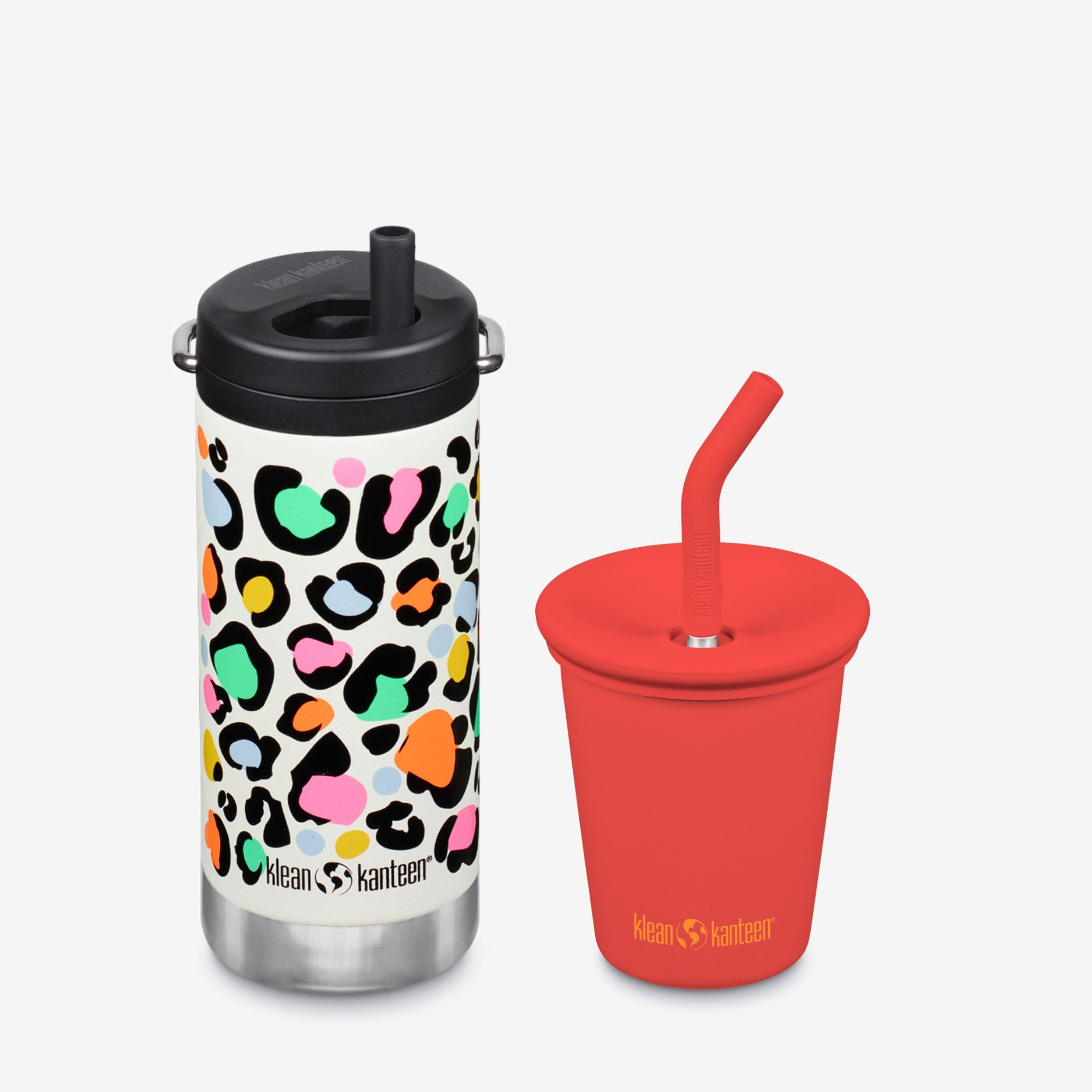 Two reusable cups with colorful leopard print and red design on a white background
