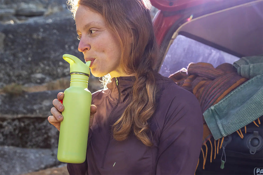 Woman drinking from sport bottle