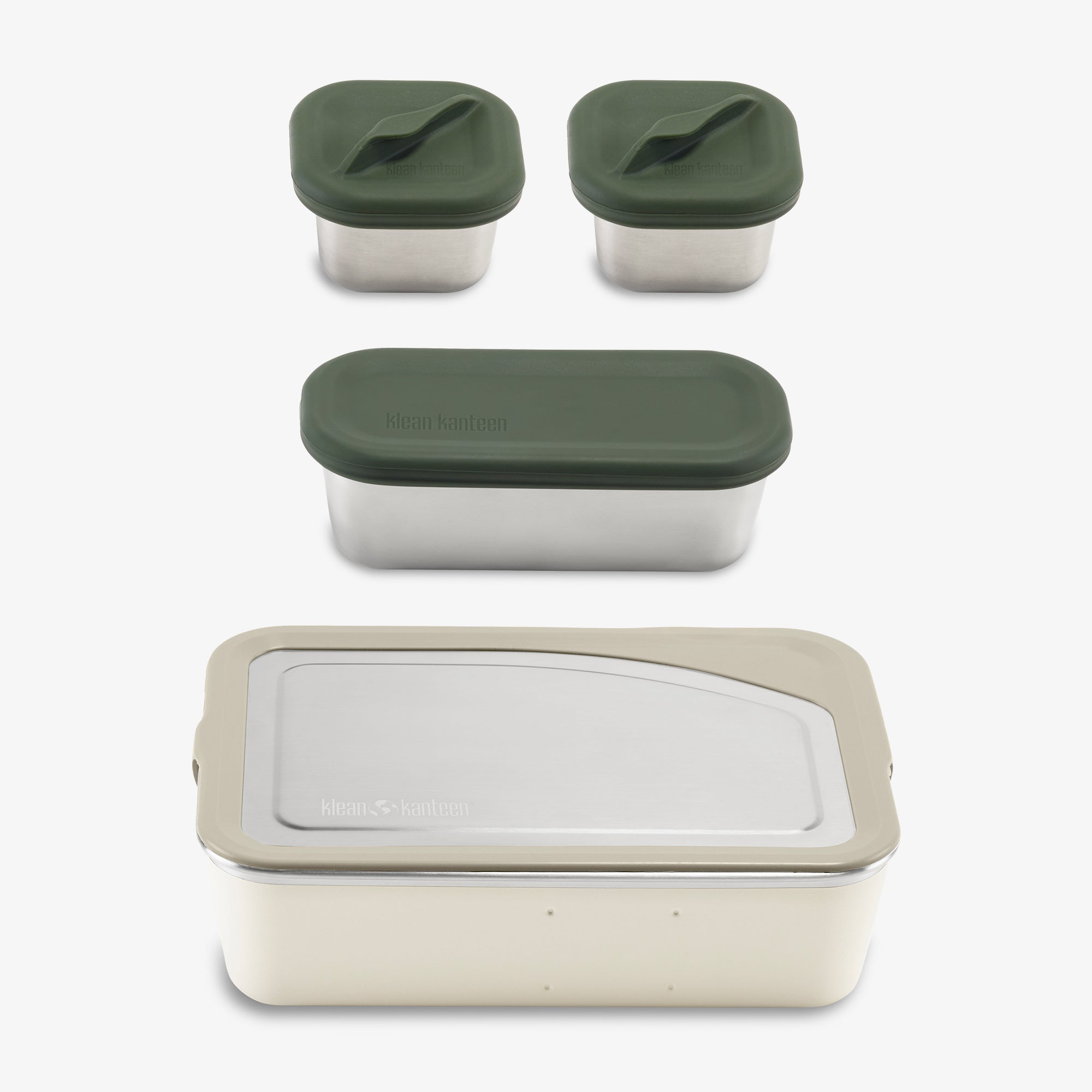 Set of food storage containers with green lids on a white background