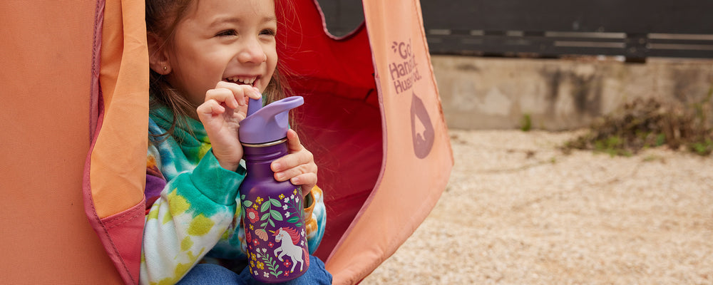 Girl in swing with water bottle