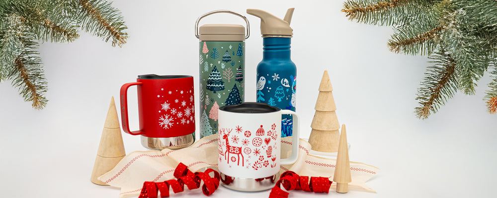 Set of Christmas-themed mugs and bottles with decorative elements on a white background