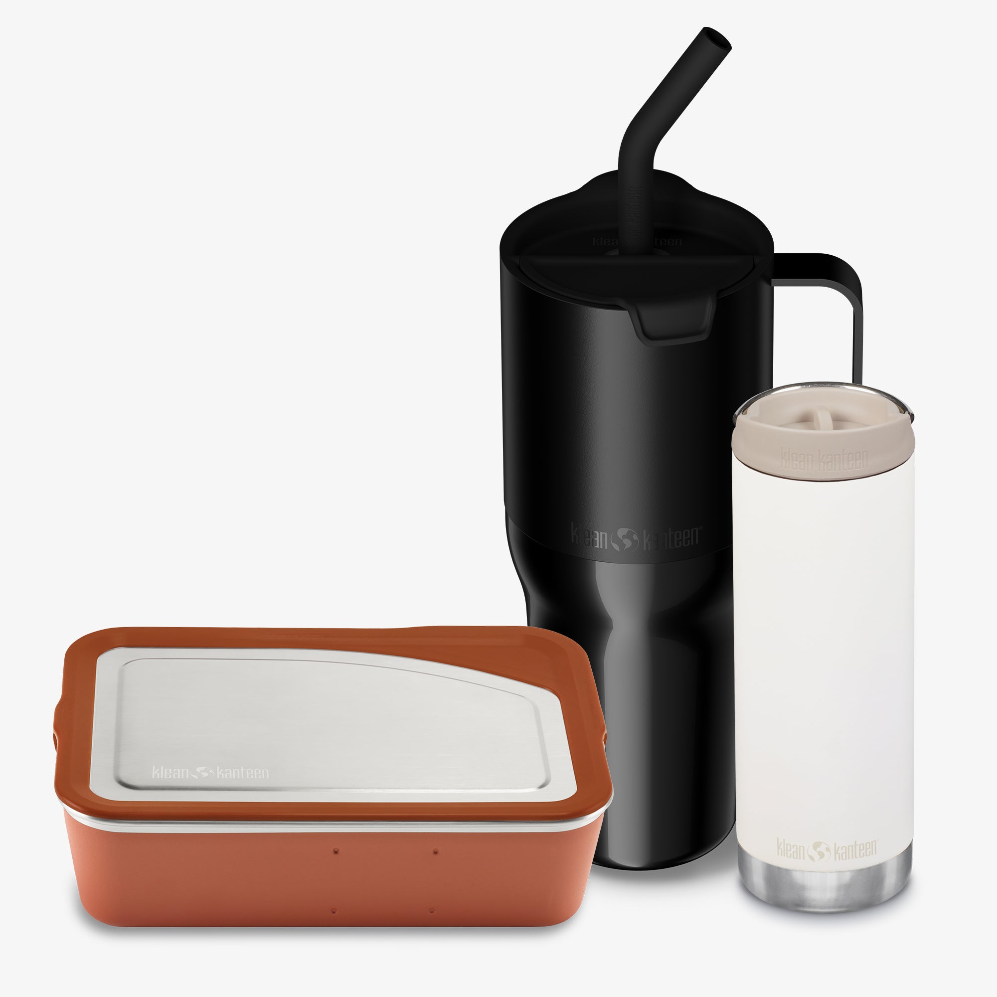 Set of reusable containers including a black tumbler with straw, clear tumbler, and brown container on a white background.
