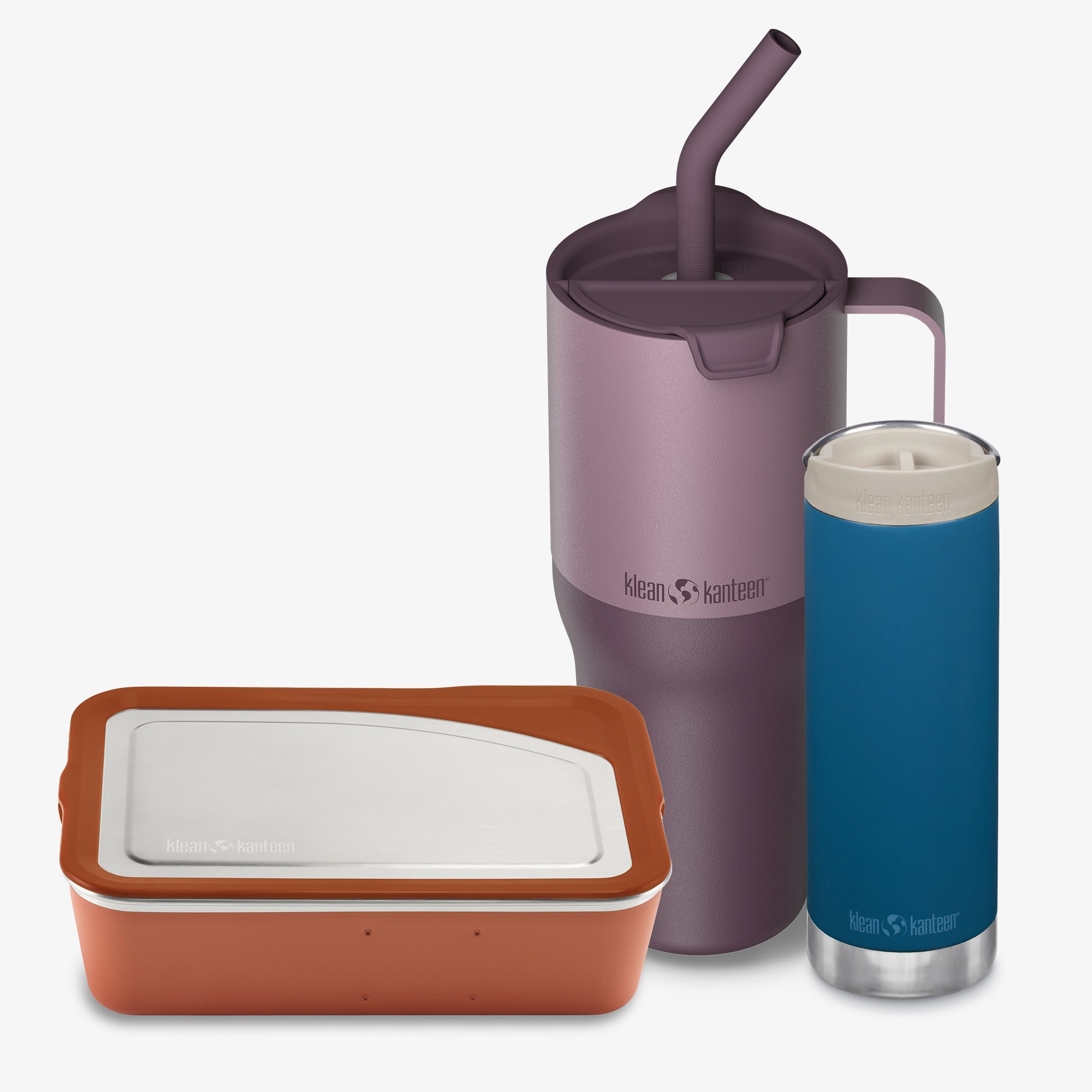 Purple tumbler with straw, brown container, and blue tumbler on a white background