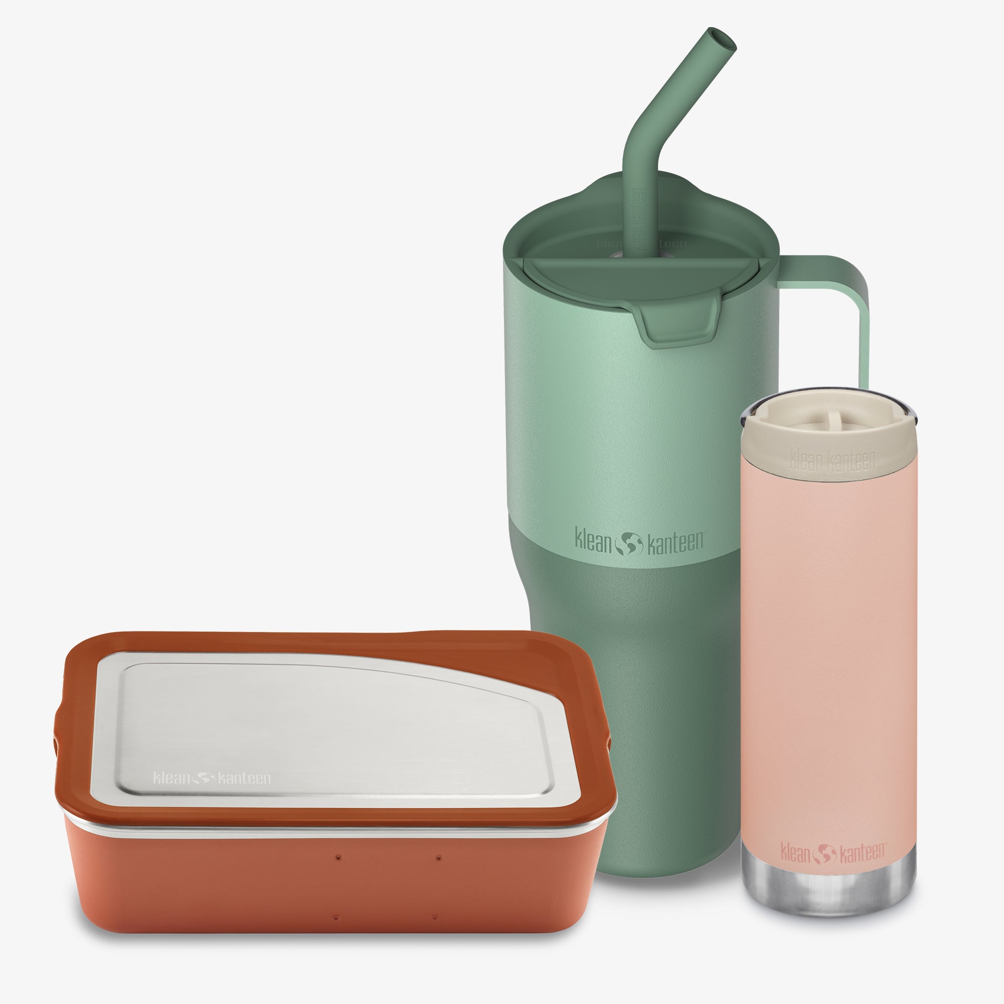 Set of reusable containers including a green tumbler with straw, pink tumbler, and brown container on a white background.