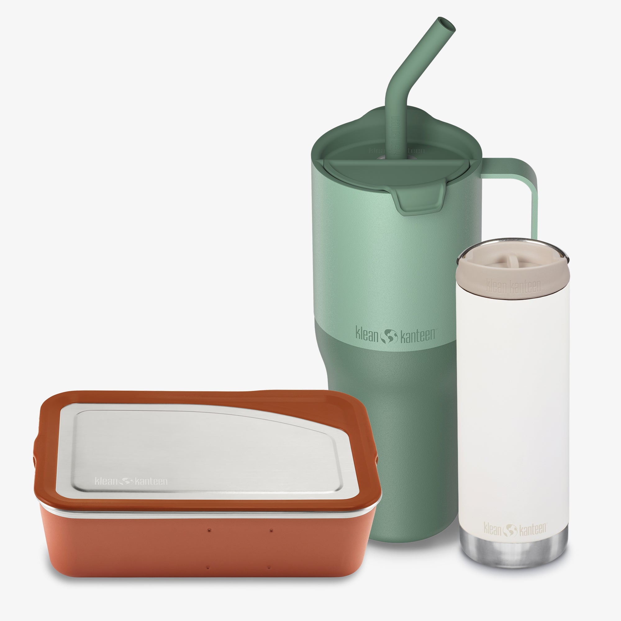 Set of reusable containers including a green mug with straw, white tumbler, and brown container on a white background.