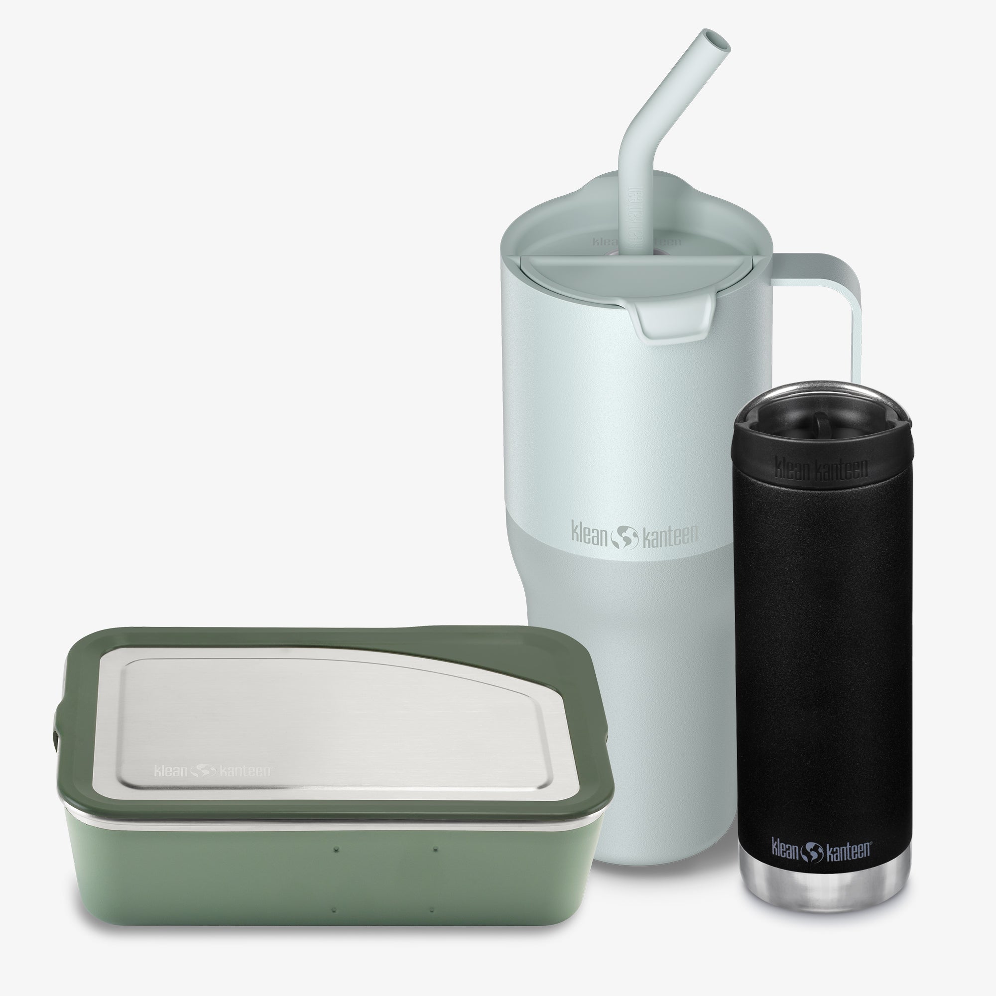 Set of reusable containers including a green food container, white mug with straw, and black insulated tumbler on a white background.