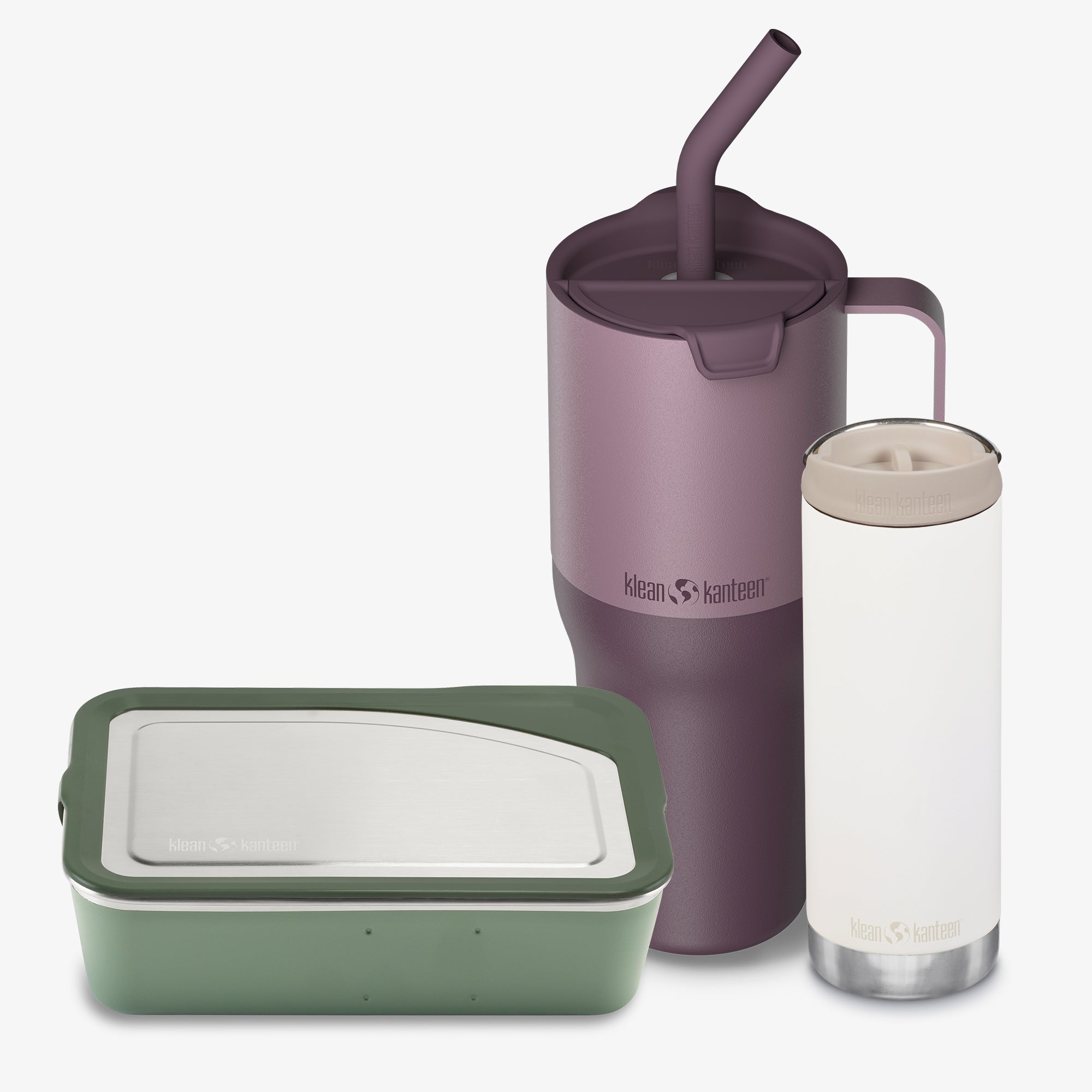 Purple tumbler with straw, clear tumbler with white lid, and green container on a white background