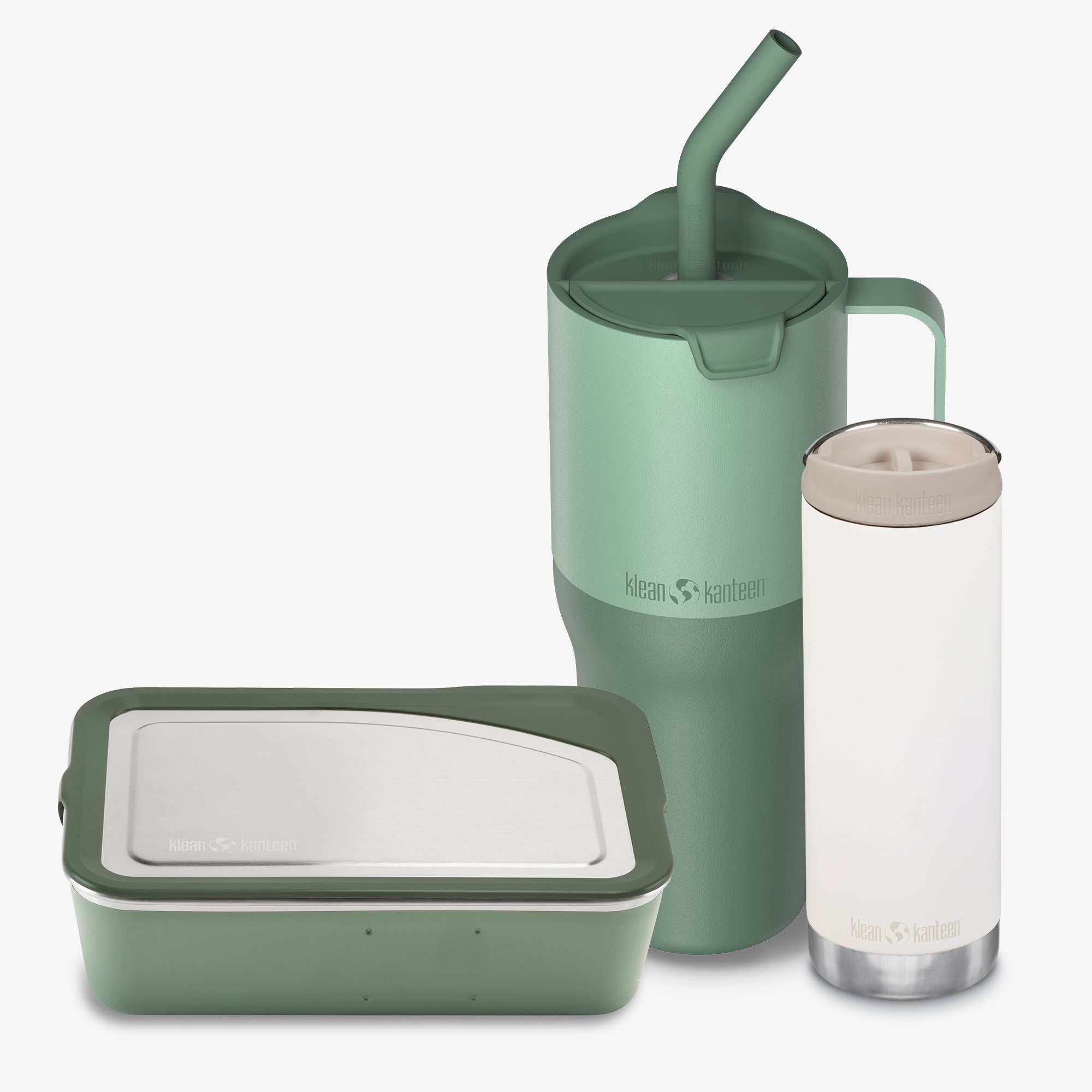 Set of green and white reusable containers with a straw on a white background