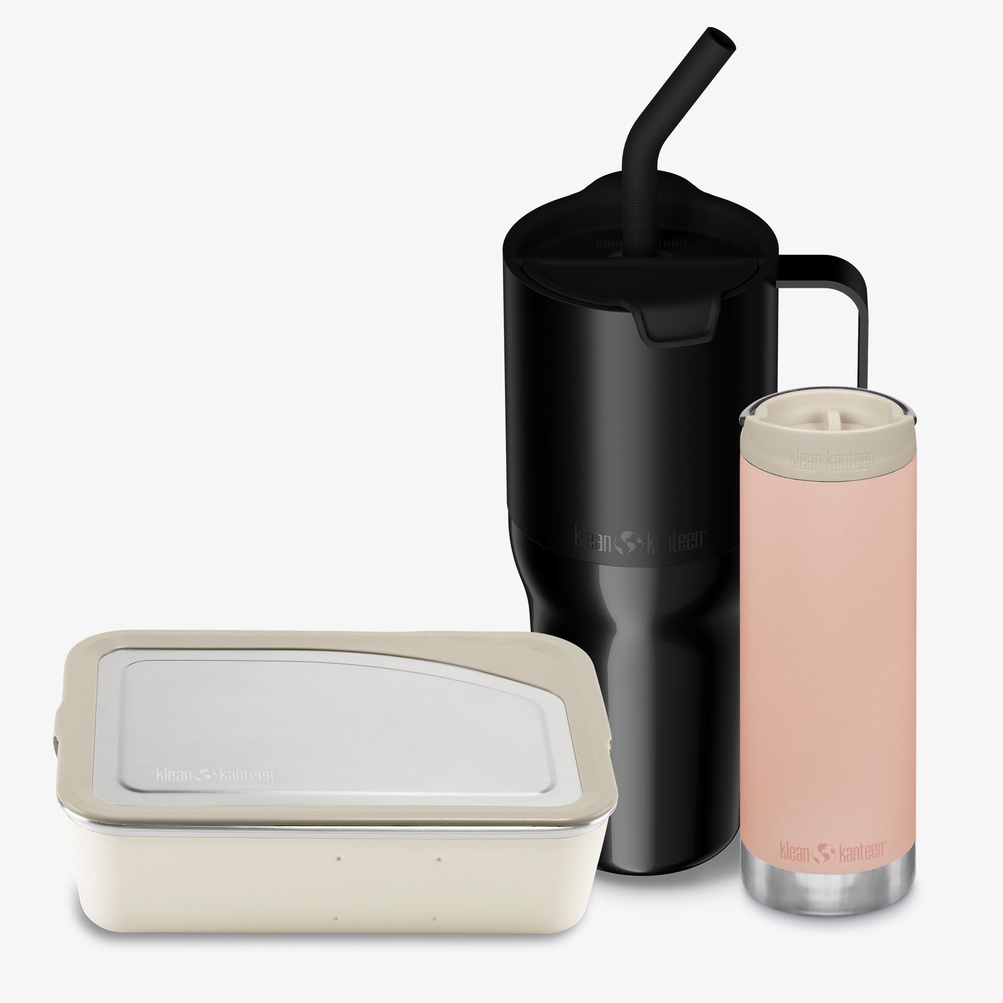 Set of reusable containers and a black mug with a straw on a white background