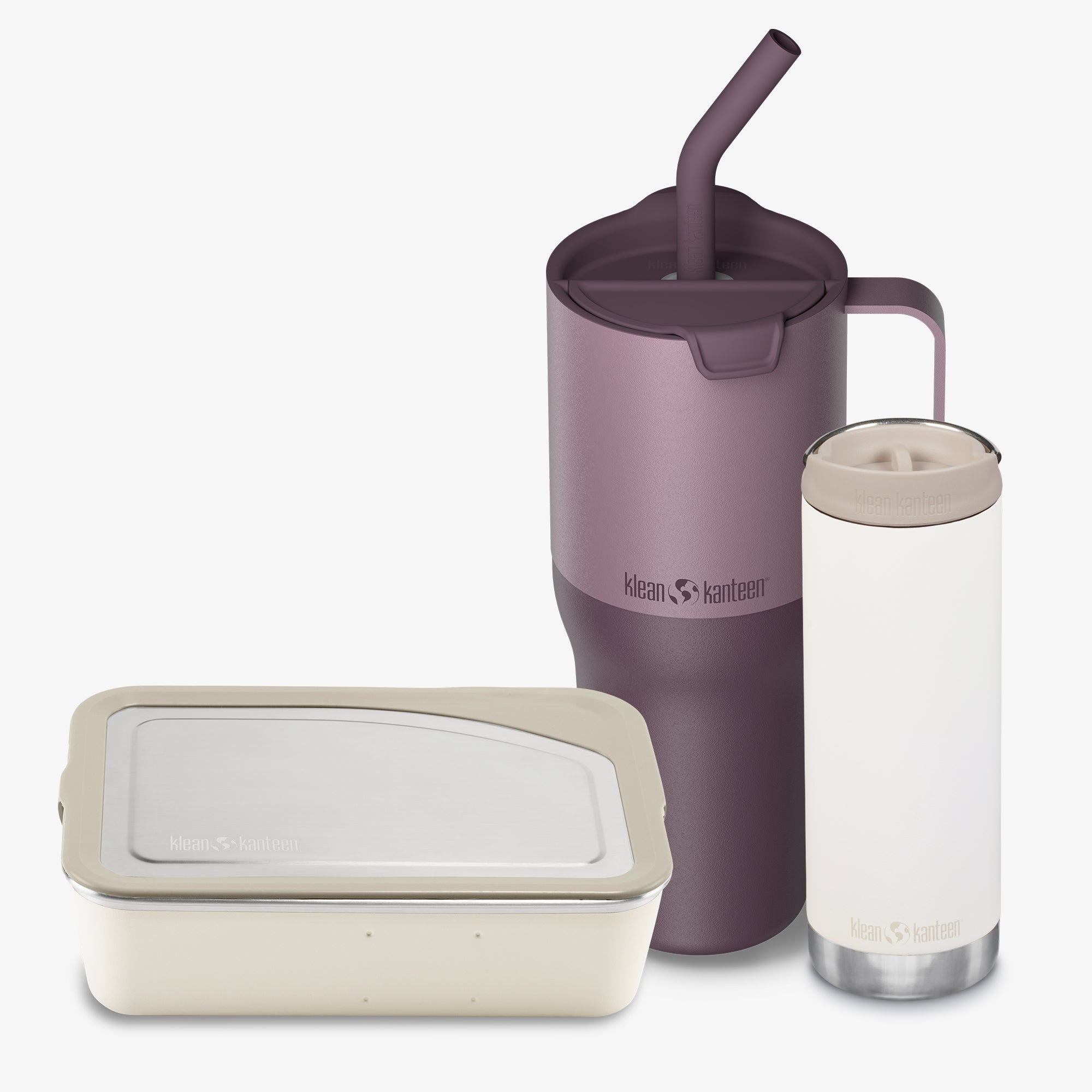 Purple tumbler with straw, beige container, and clear cup with beige lid on a white background