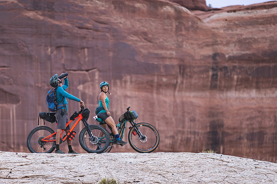 Water Bottle and Mountain Bikers